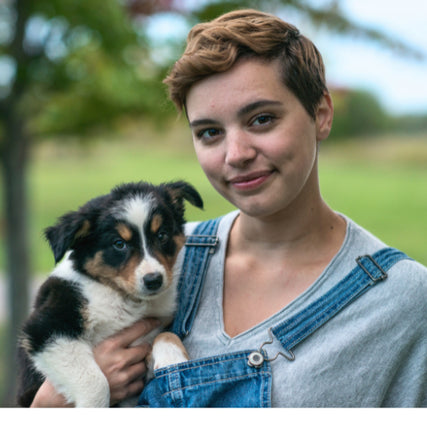 Pet Food & SuppliesWoman holding a puppy